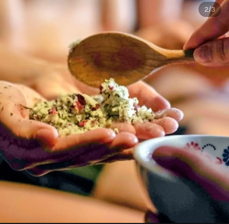a person holding a body scrub in their hand 