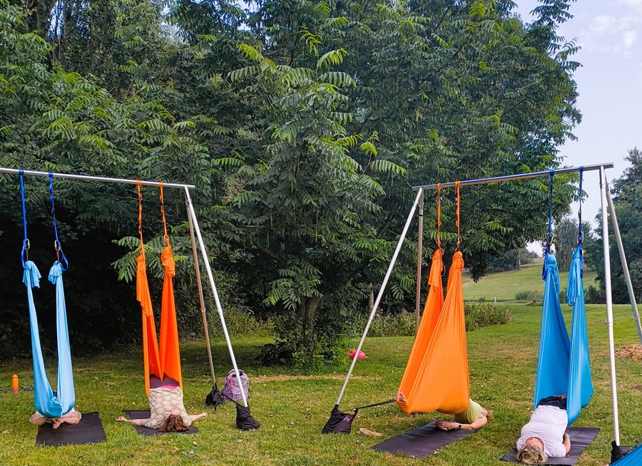 people relaxing in a hammock 