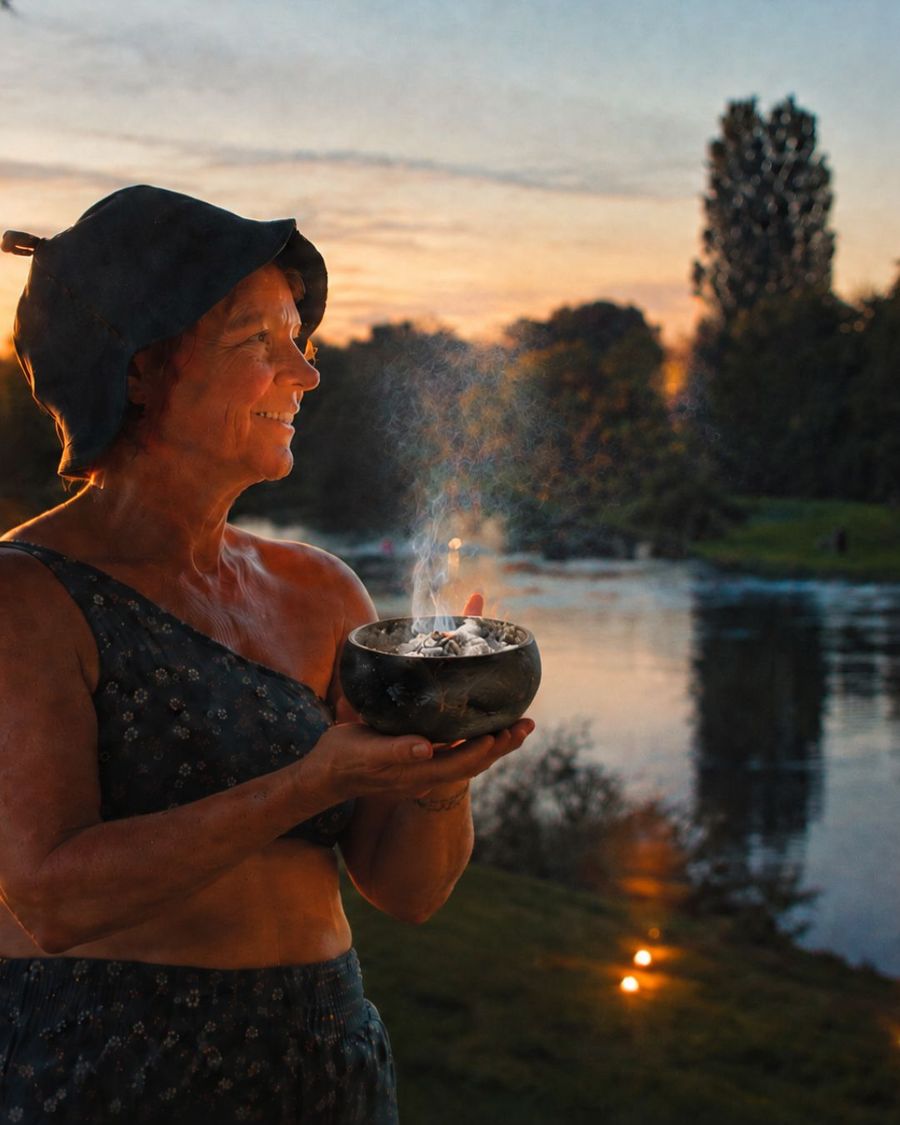 Nix standing by the lake with smoke bowl