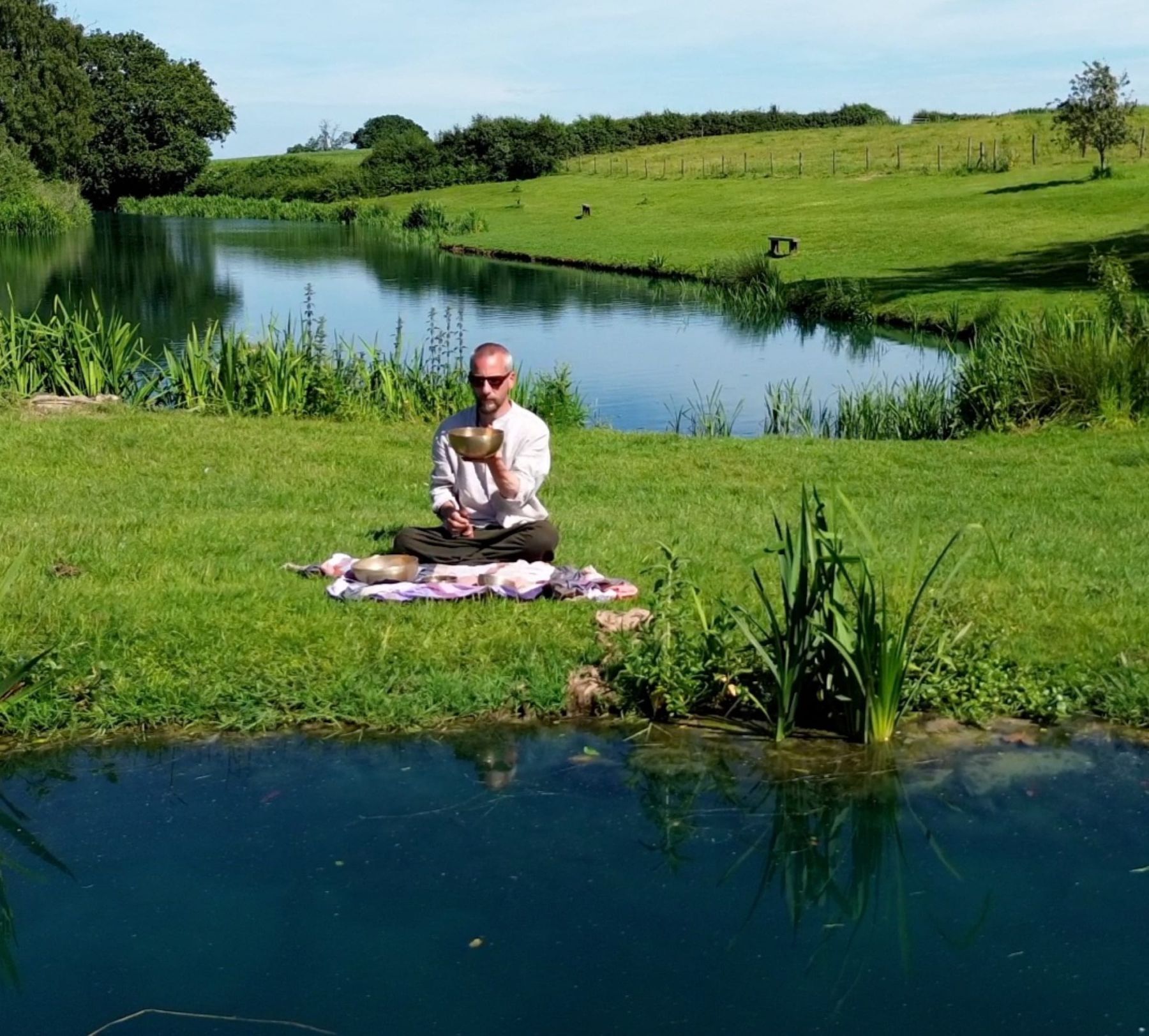 A singing bowl played on the bank of the lake, Sauna & Sound Meditation at Court Farm Lakes