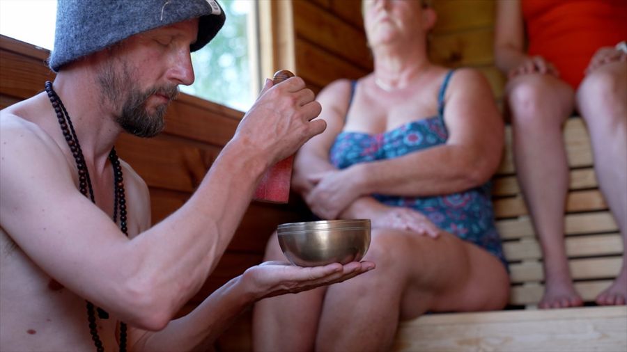 Shyen playing a singing bowl in the sauna, Court Farm Lakes