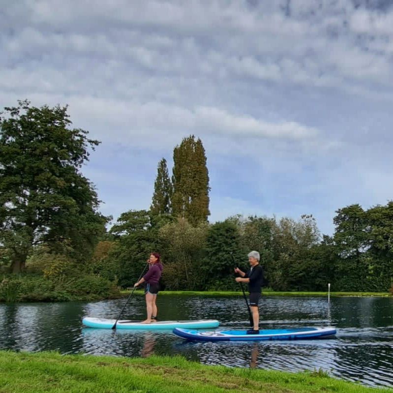 Karen Maidment paddleboarding on the lake, Court Farm Lakes
