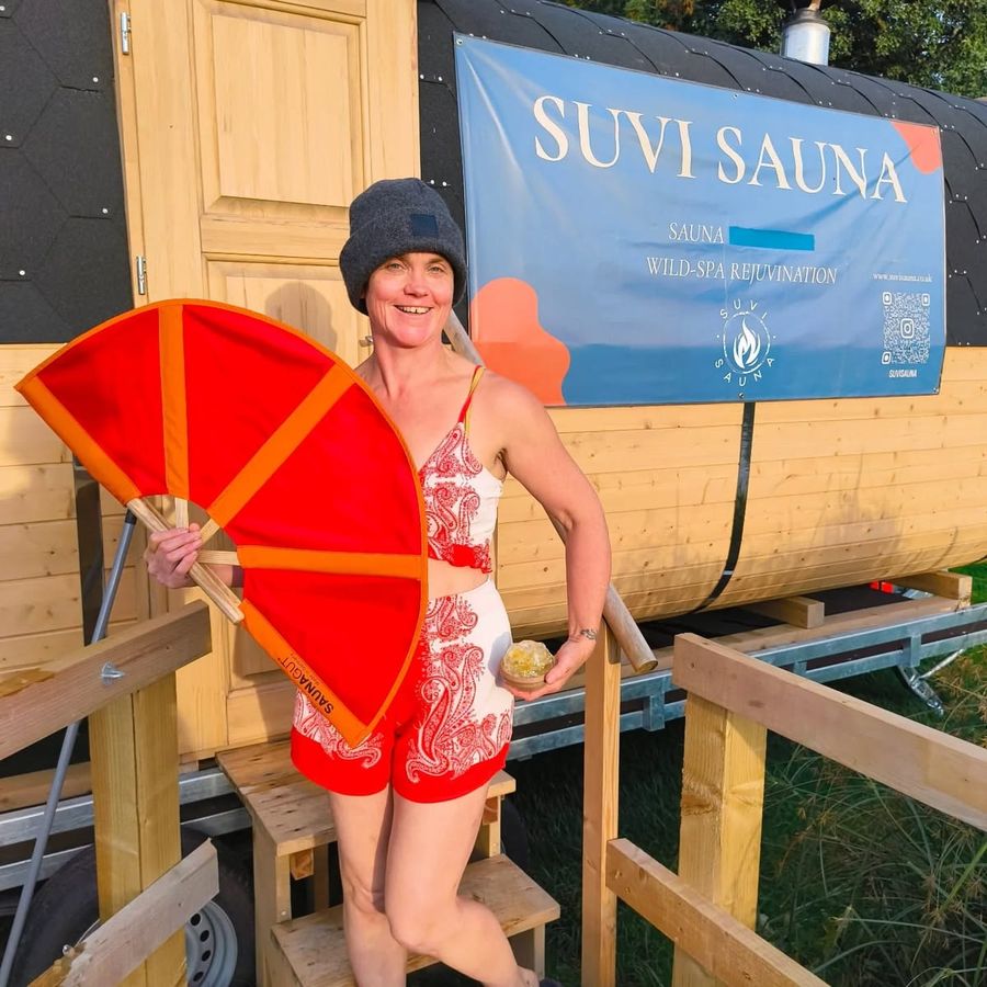 Nix Barnaville with a fan outside the sauna, Court Farm Lakes