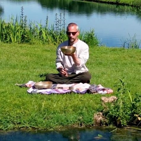Shyen playing a singing bowl on the bank, Court Farm Lakes